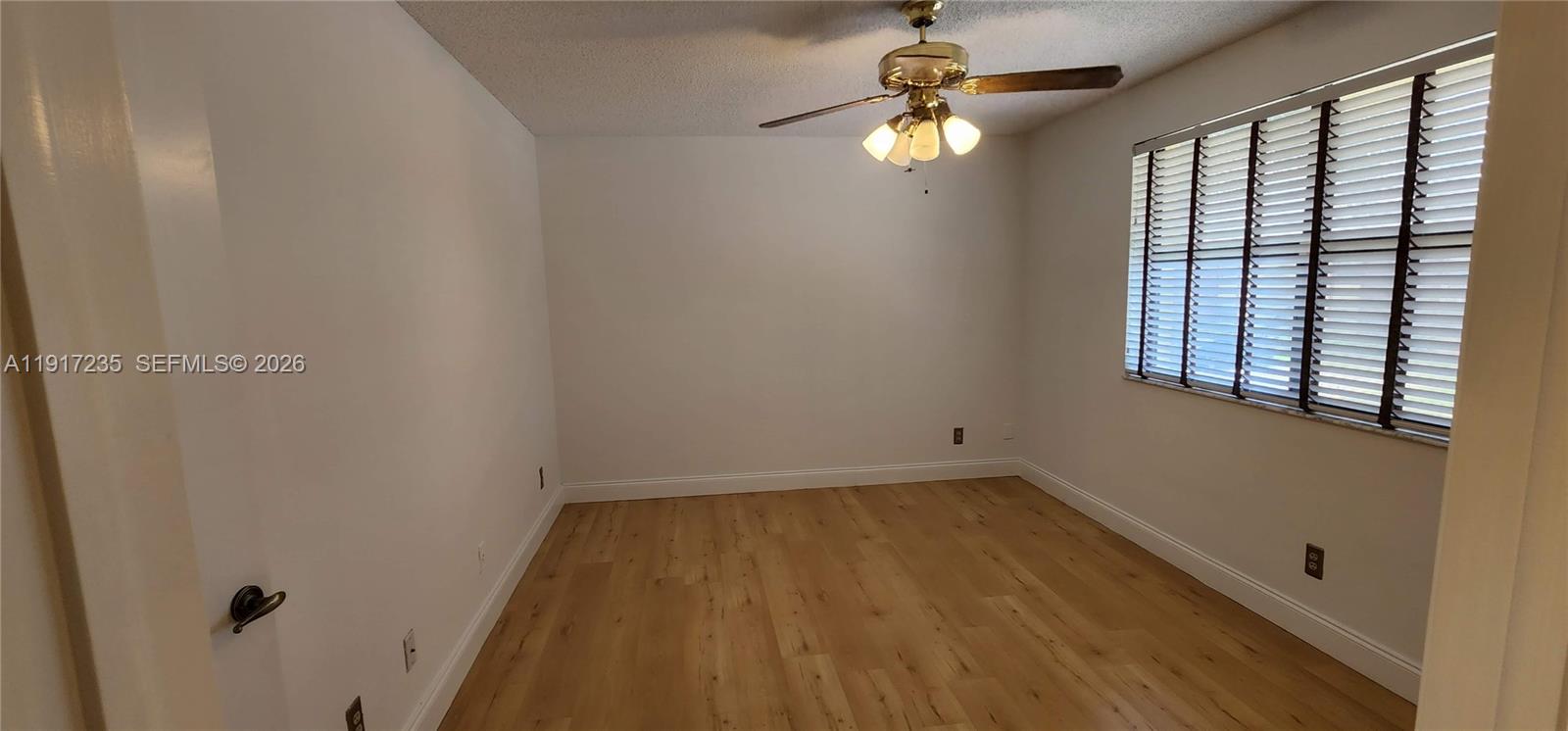 10029 Winding Lake Road, Unit 201 Sunrise, FL 33351 - Photo 19 of 22 a view of empty room with window