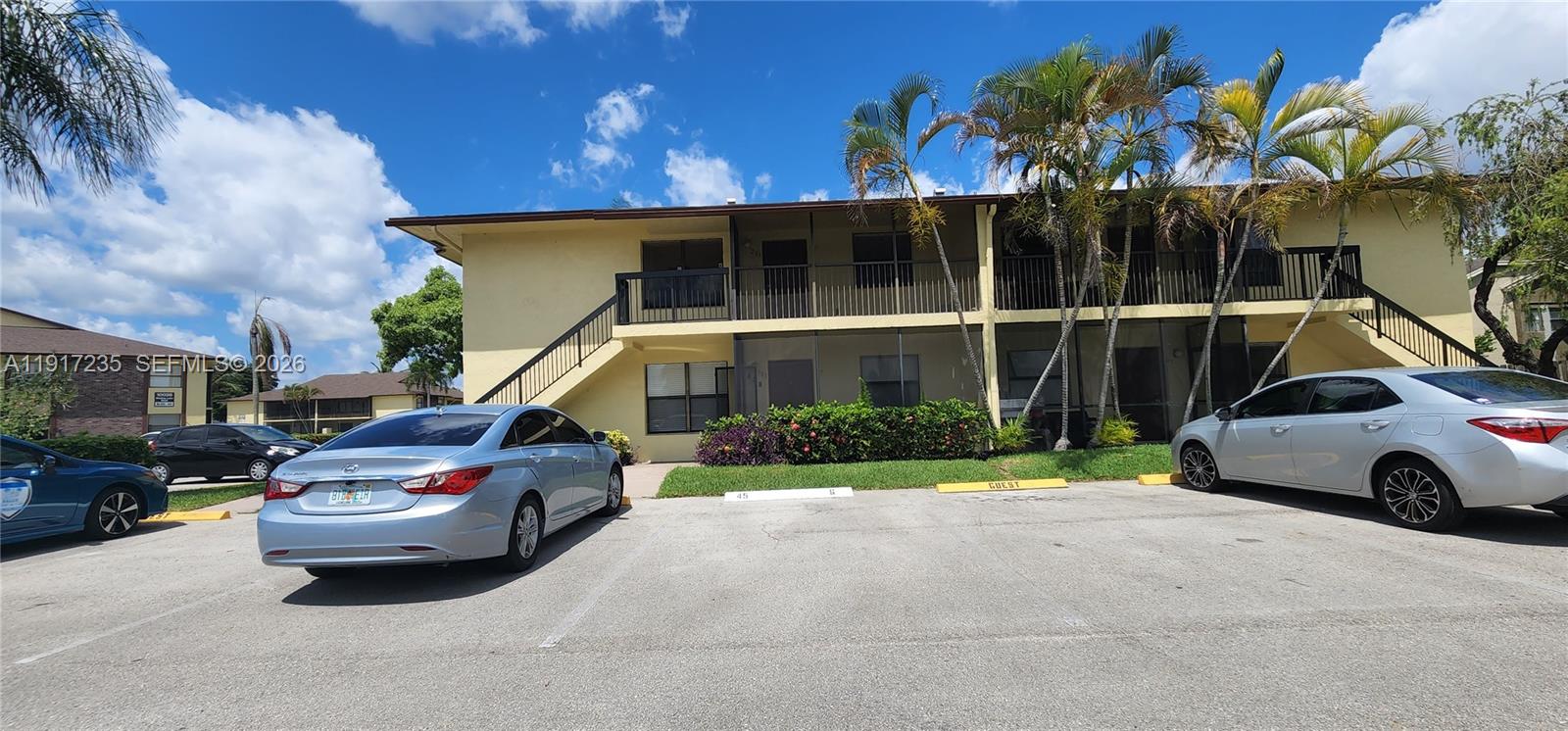 10029 Winding Lake Road, Unit 201 Sunrise, FL 33351 - Photo 20 of 22 a car parked in front of a house