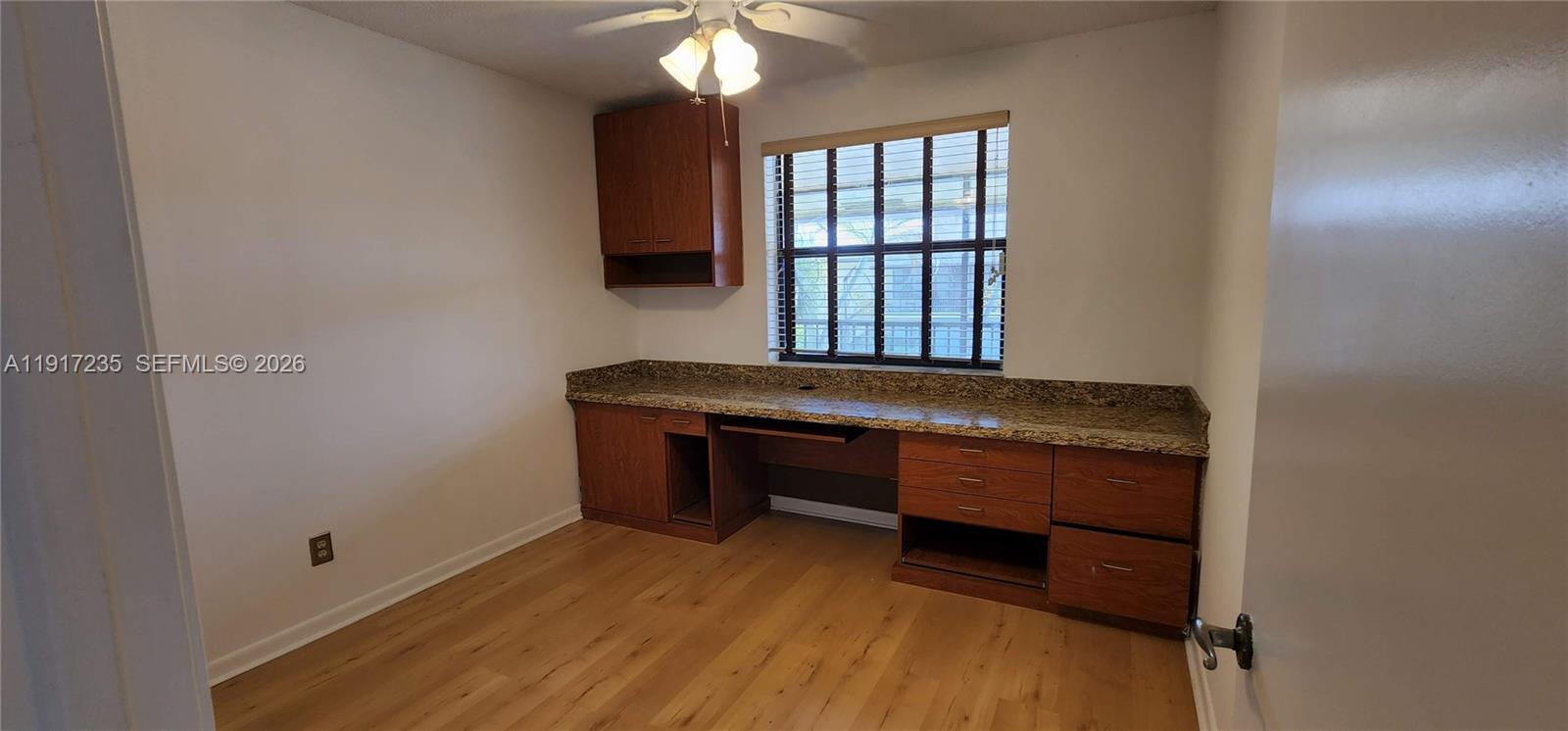 10029 Winding Lake Road, Unit 201 Sunrise, FL 33351 - Photo 10 of 22 a room with window and table