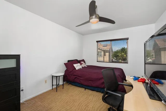 a bed room with a bed and a window