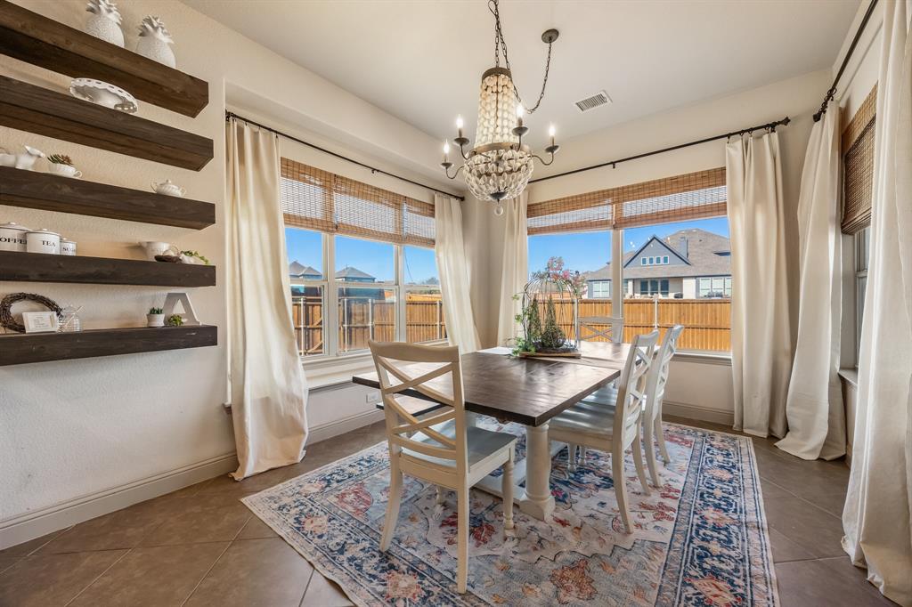 1206 Wedgewood Drive Forney, TX 75126 - Photo 17 of 40 a view of a dining room with furniture window and outside view