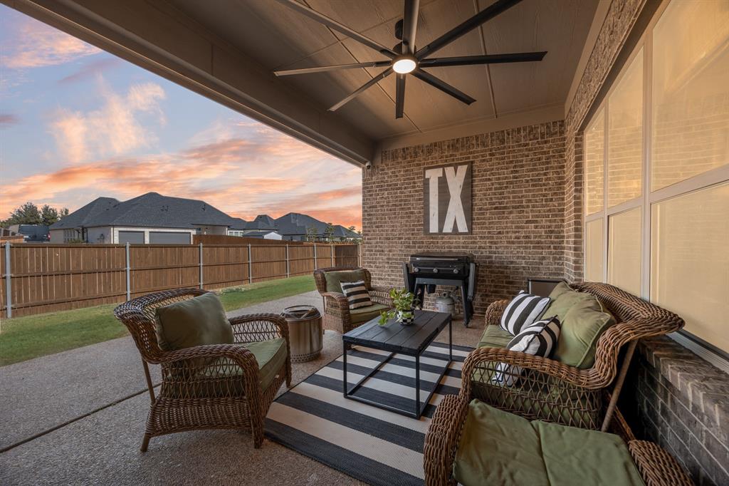 1206 Wedgewood Drive Forney, TX 75126 - Photo 2 of 40 a balcony with furniture and a fireplace