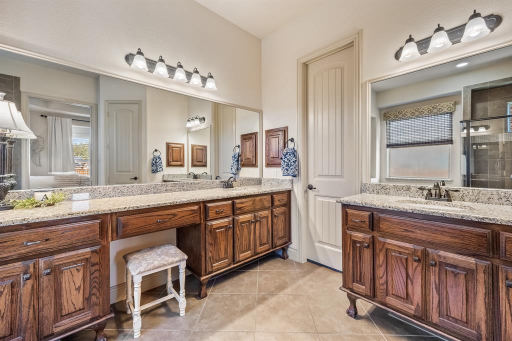 1206 Wedgewood Drive Forney, TX 75126 - Photo 25 of 40 a bathroom with a sink vanity and mirror