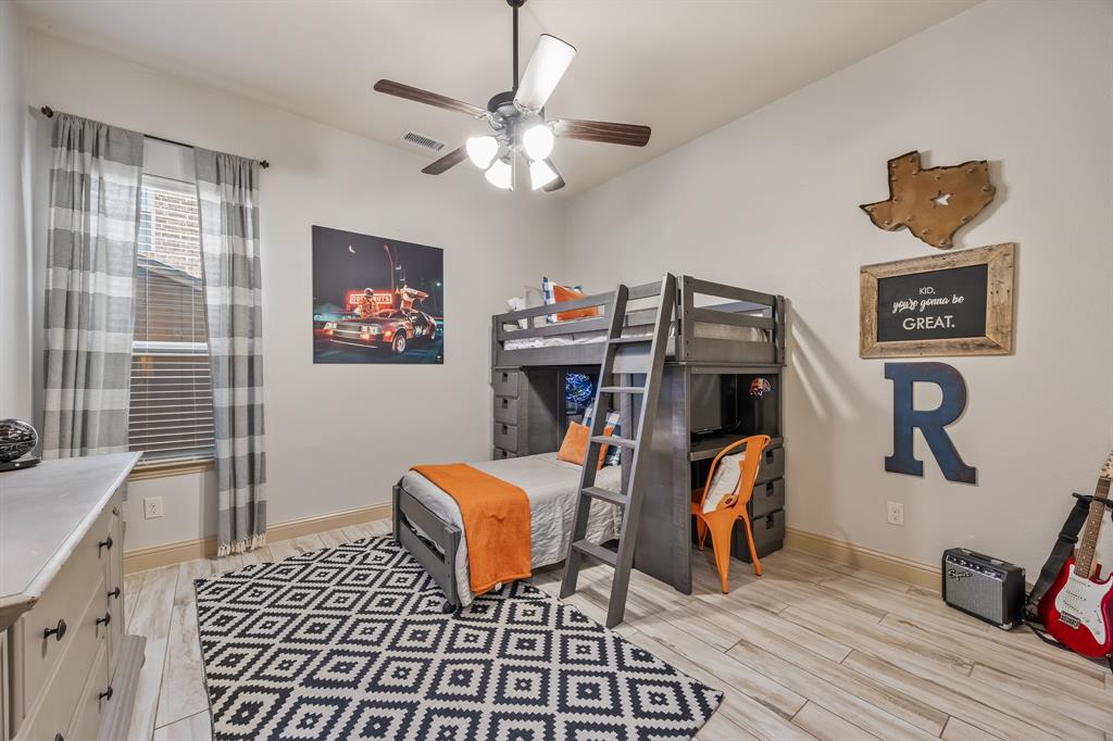 1206 Wedgewood Drive Forney, TX 75126 - Photo 28 of 40 a bedroom with furniture and a window