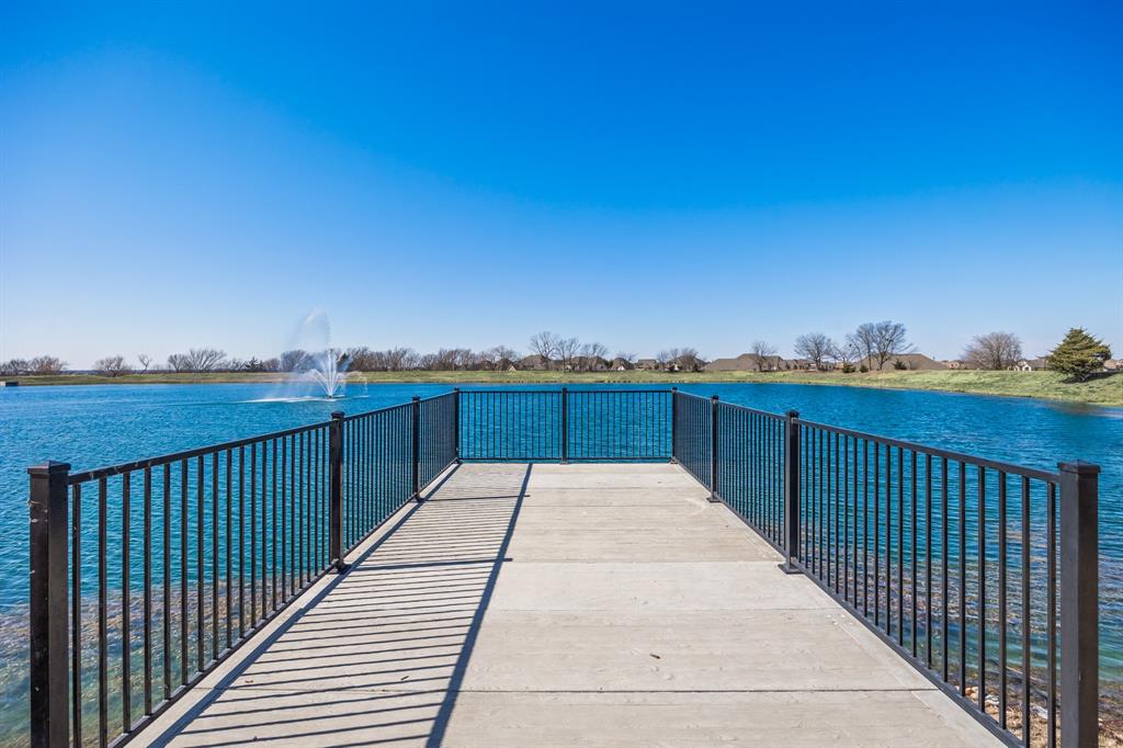 1206 Wedgewood Drive Forney, TX 75126 - Photo 39 of 40 a view of a balcony with wooden floor and city view