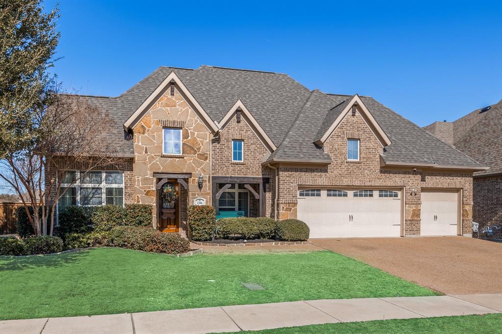 1206 Wedgewood Drive Forney, TX 75126 - Photo 5 of 40 a front view of a house with a garden and plants
