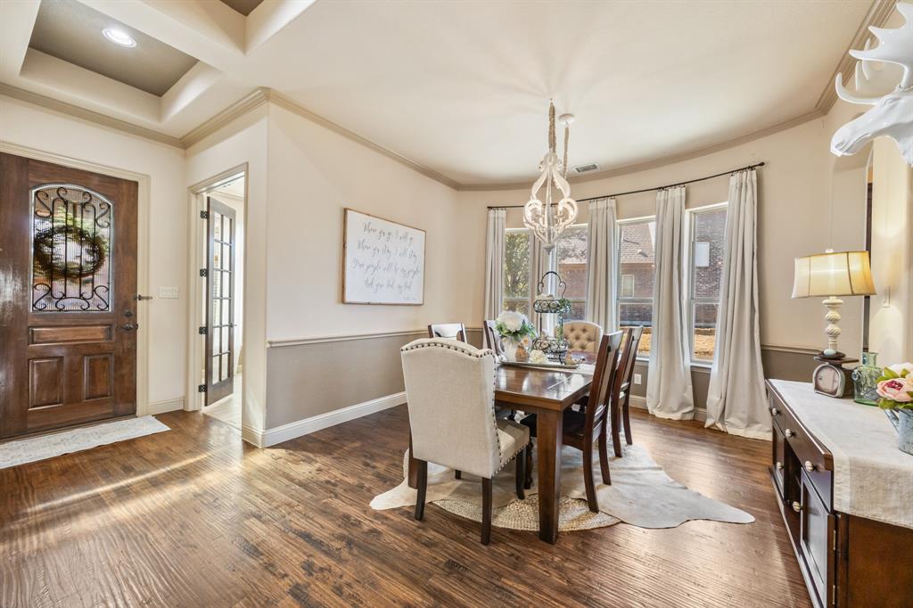1206 Wedgewood Drive Forney, TX 75126 - Photo 9 of 40 a dining room with furniture window wooden floor