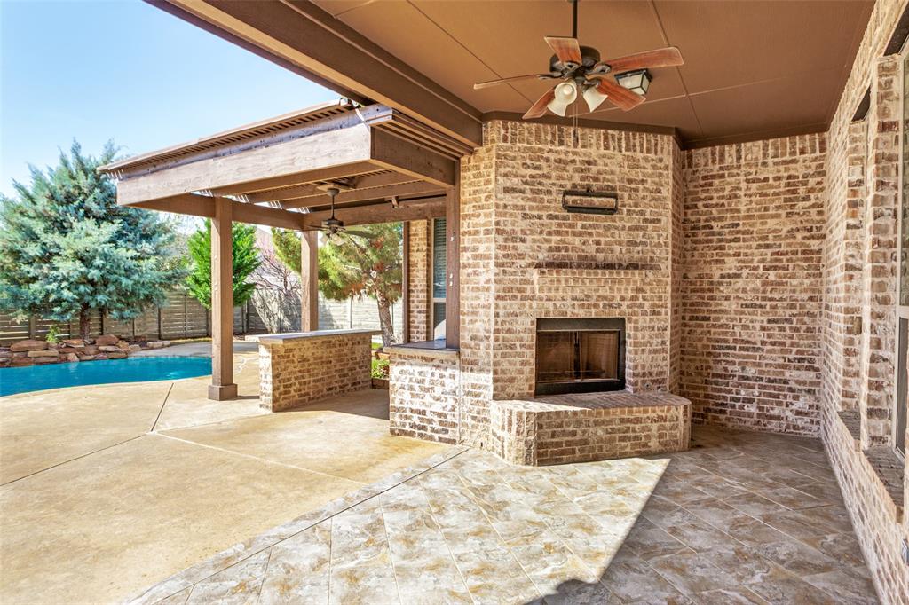 1505 5th Street Argyle, TX 76226 - Photo 25 of 25 a view of a patio with a fireplace