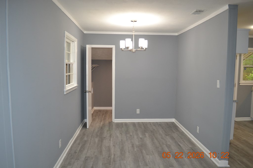 5552 Valleybrook Road Columbus, GA 31907 - Photo 2 of 27 wooden floor in an empty room with a window
