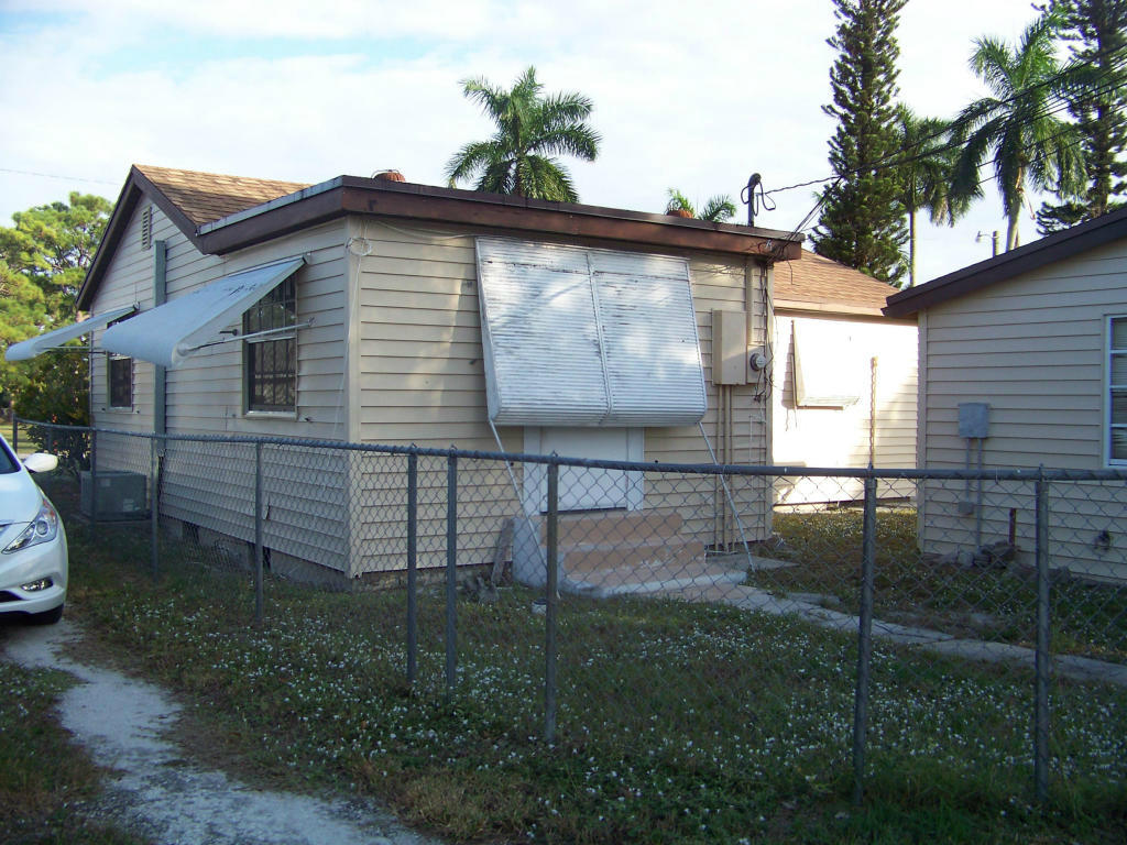 3837 Gulfstream Road Lake Worth, FL 33461 - Photo 7 of 32 Back of Main House and Storage Workshop
