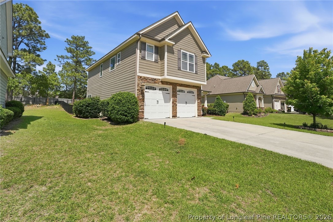 886 Micahs Way North Spring Lake, NC 28390 - Photo 42 of 50 a front view of a house with a yard