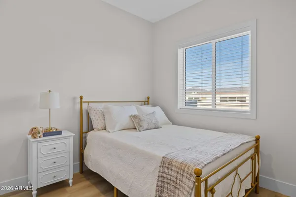 a bedroom with a bed and window