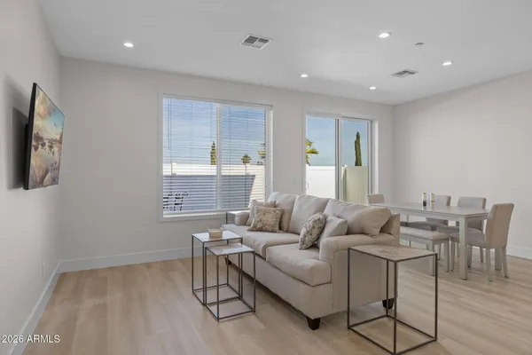 a living room with furniture and a window
