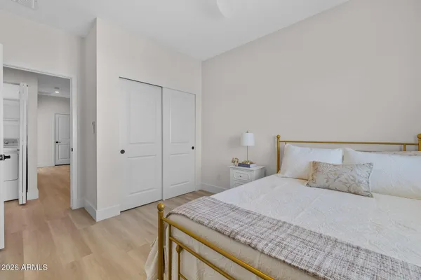 a bedroom with a bed and closet