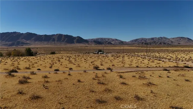 a view of wooden floor and a view of outdoor space