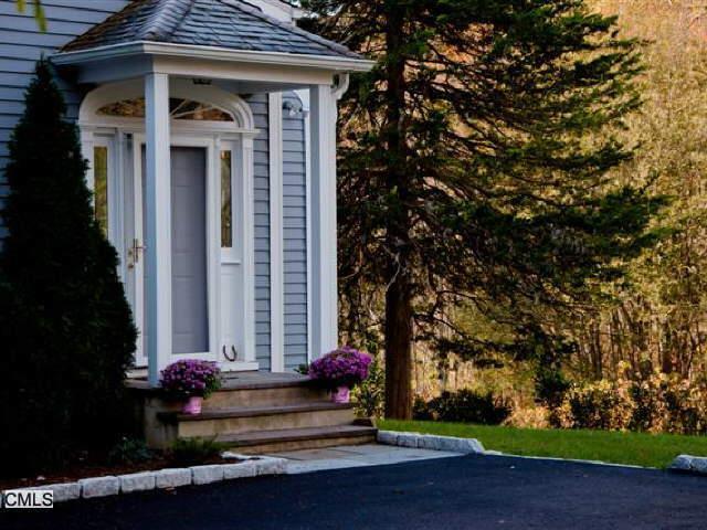 23 Limestone Road Ridgefield, CT 06877 - Photo 1 of 1 a front view of a house with a yard
