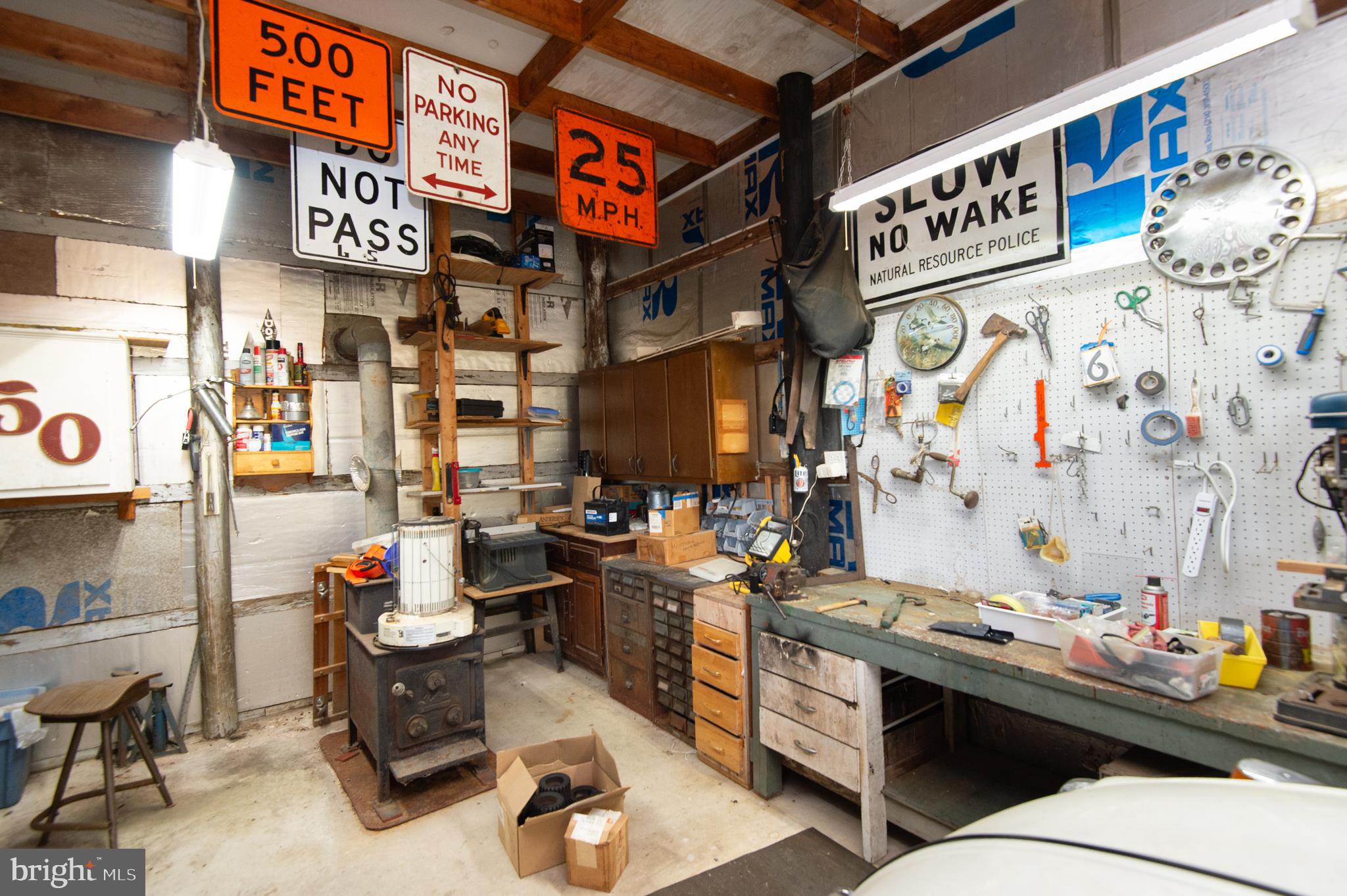 6046 Todds Point Road Cambridge, MD 21613 - Photo 73 of 94 Wood Stove in Garage/Workshop