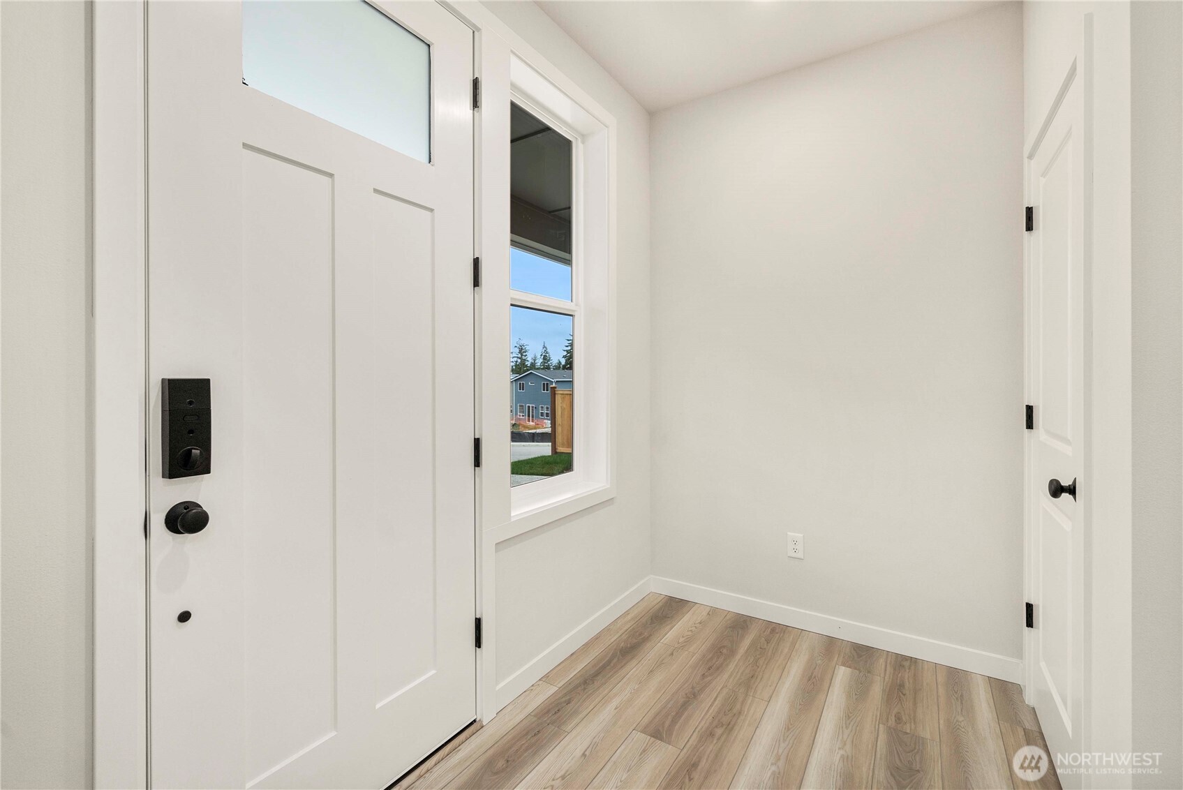32329 Bryant Road Sultan, WA 98294 - Photo 22 of 38 a view of a hallway with wooden floor and a bathroom