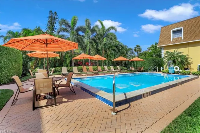 a view of a chairs and table in the patio