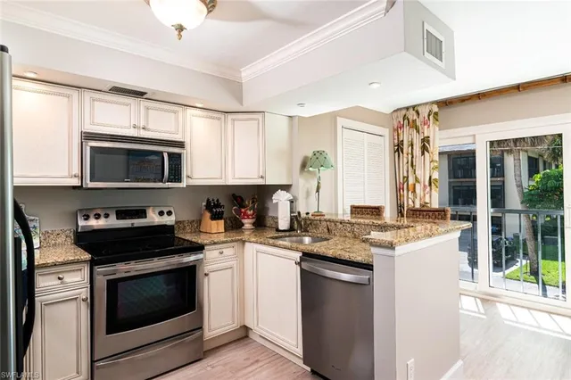 a kitchen with a stove and a microwave