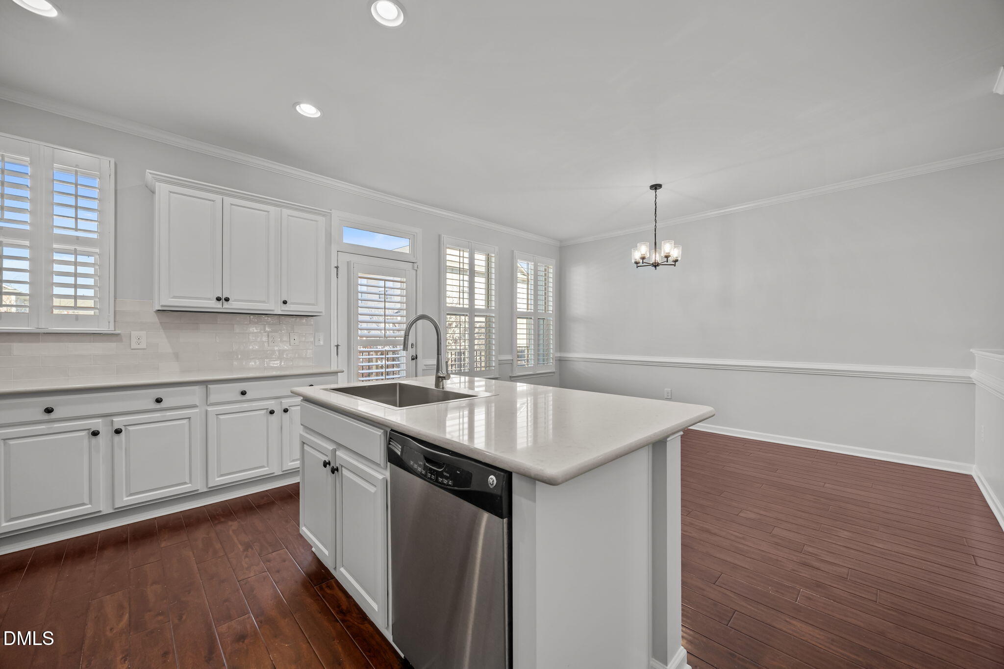 1319 Rodessa Run Raleigh, NC 27607 - Photo 11 of 64 a kitchen with sink cabinets and wooden floor