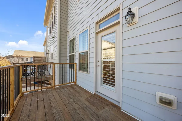 an empty room with a ceiling fan and a window