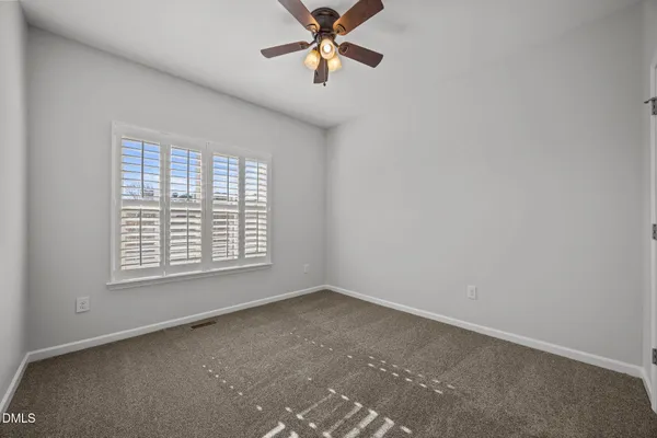 wooden floor and cabinet in an empty room
