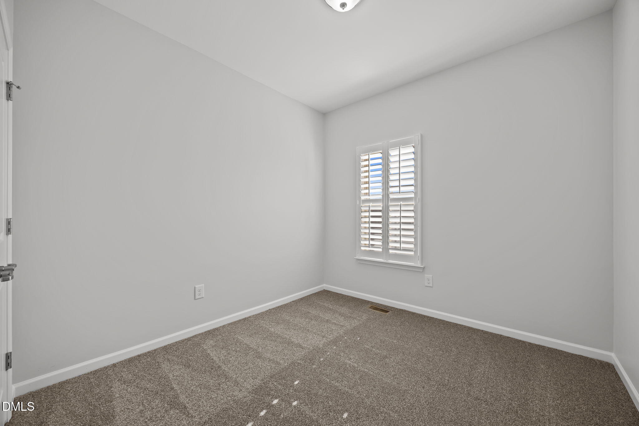 1319 Rodessa Run Raleigh, NC 27607 - Photo 35 of 64 an empty room with a window