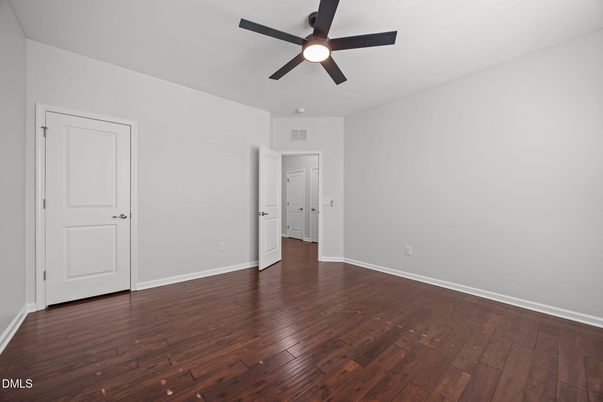 1319 Rodessa Run Raleigh, NC 27607 - Photo 40 of 64 a view of an empty room with wooden floor