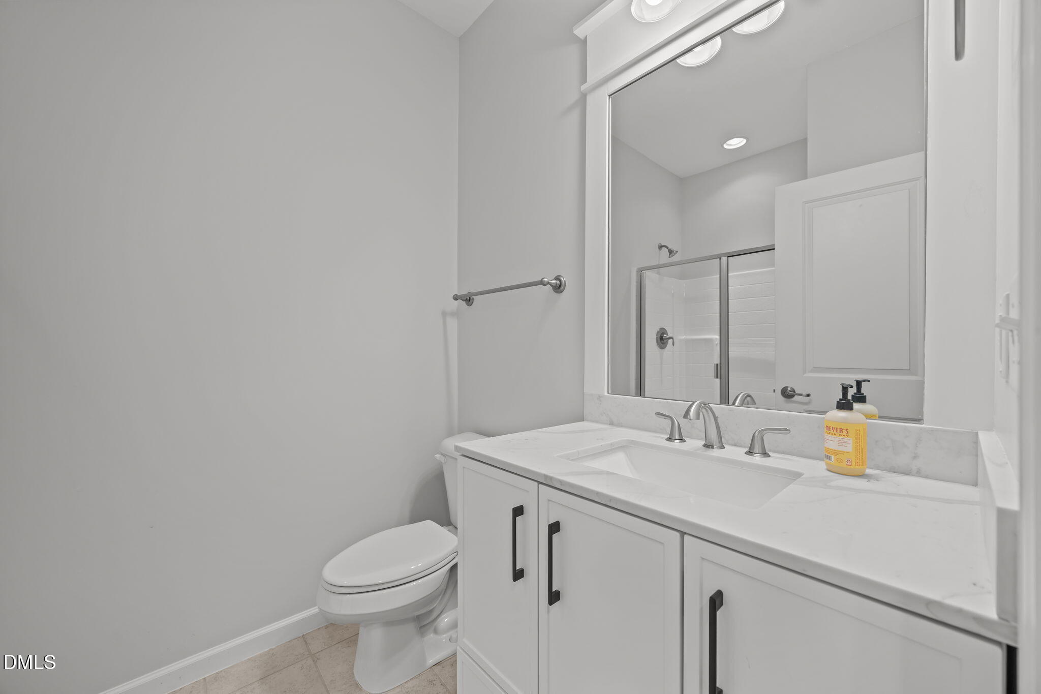 1319 Rodessa Run Raleigh, NC 27607 - Photo 41 of 64 a bathroom with a sink a toilet and a mirror