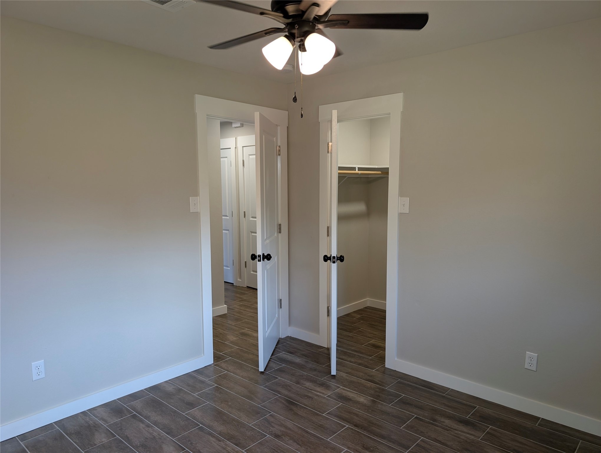 1145 Cuniff Road Sour Lake, TX 77659 - Photo 18 of 22 wooden floor in an empty room with a window
