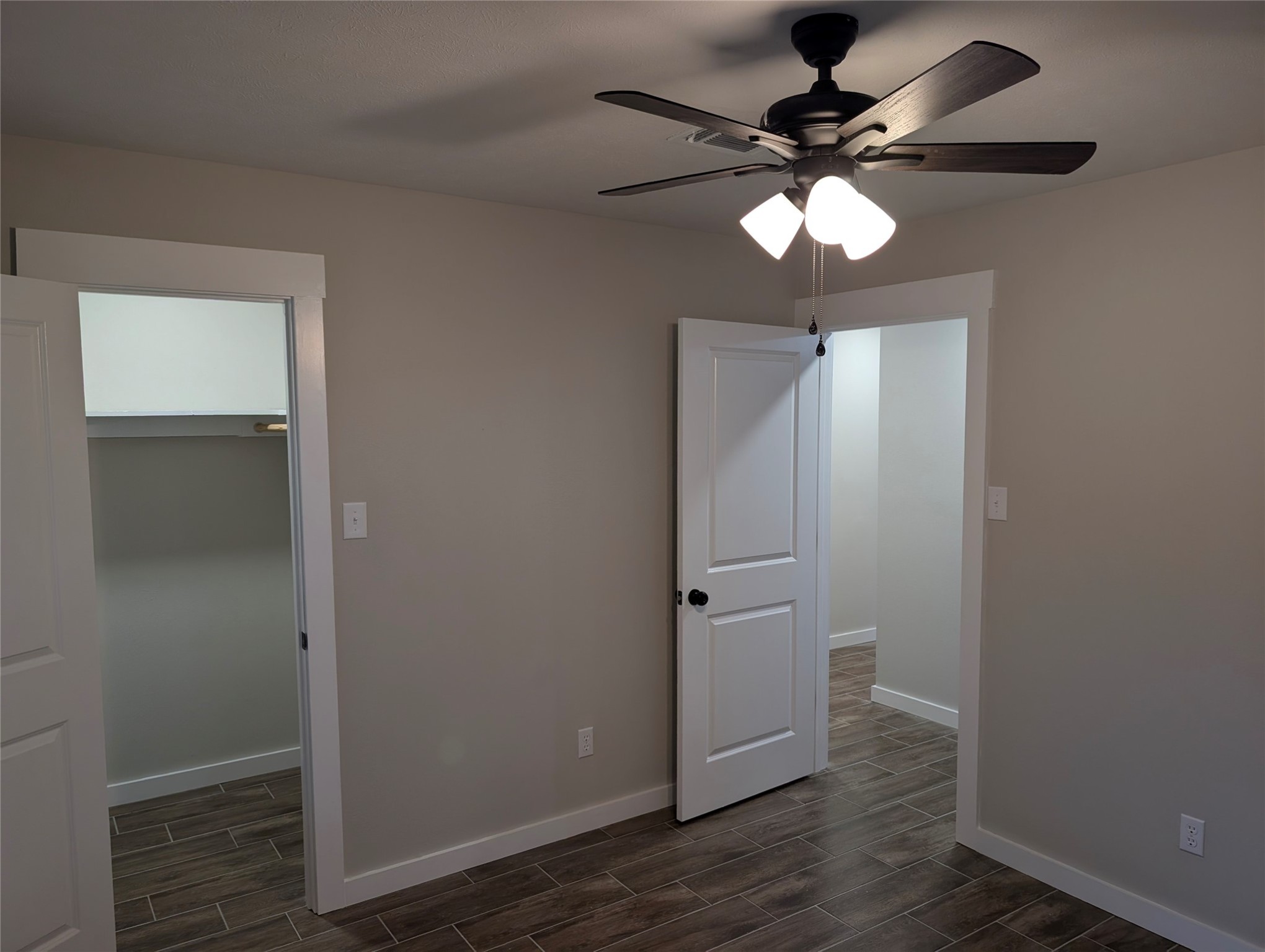 1145 Cuniff Road Sour Lake, TX 77659 - Photo 20 of 22 wooden floor in an empty room with a mirror