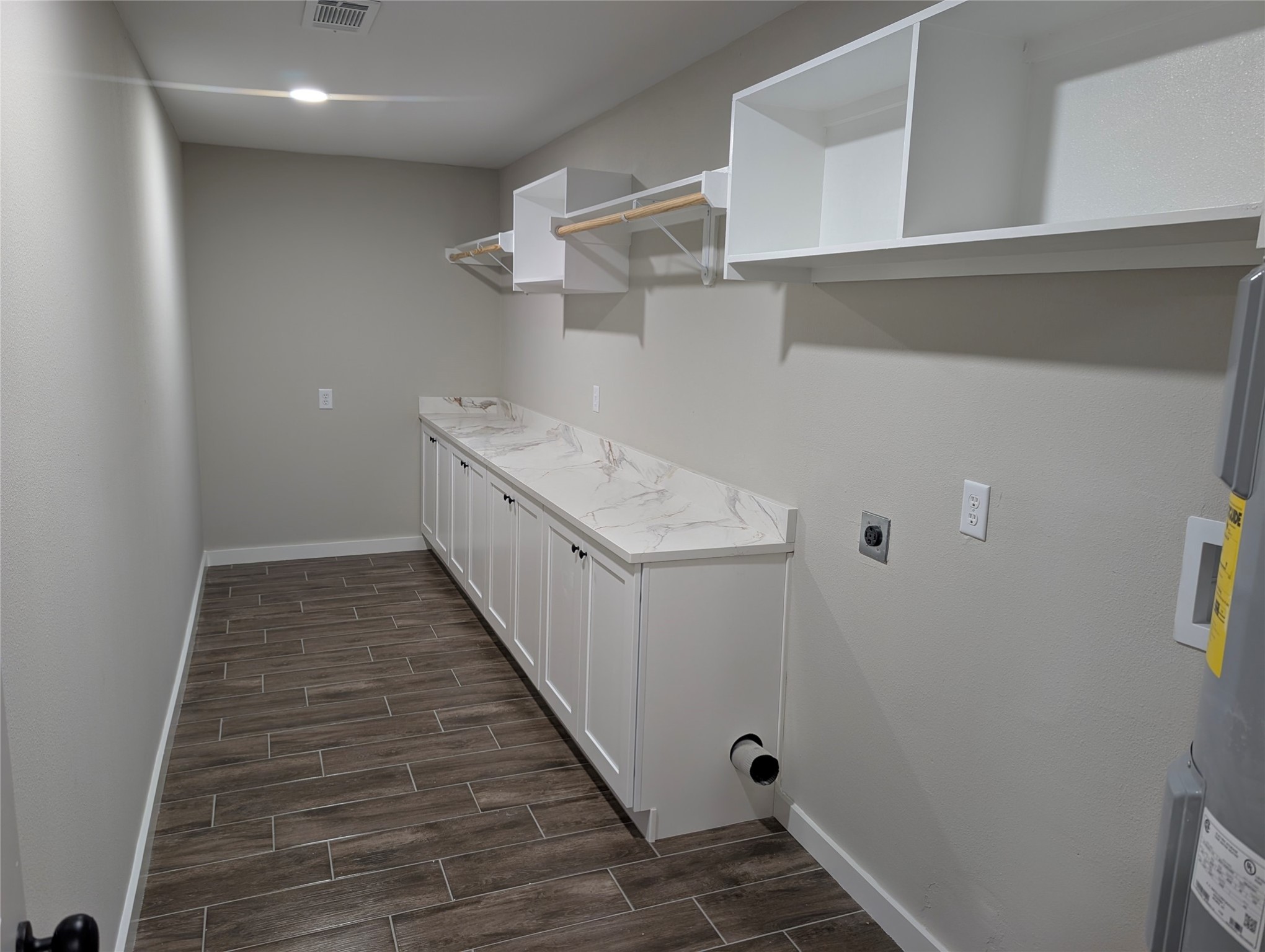 1145 Cuniff Road Sour Lake, TX 77659 - Photo 8 of 22 Large laundry room with storage and space for a deep freeze