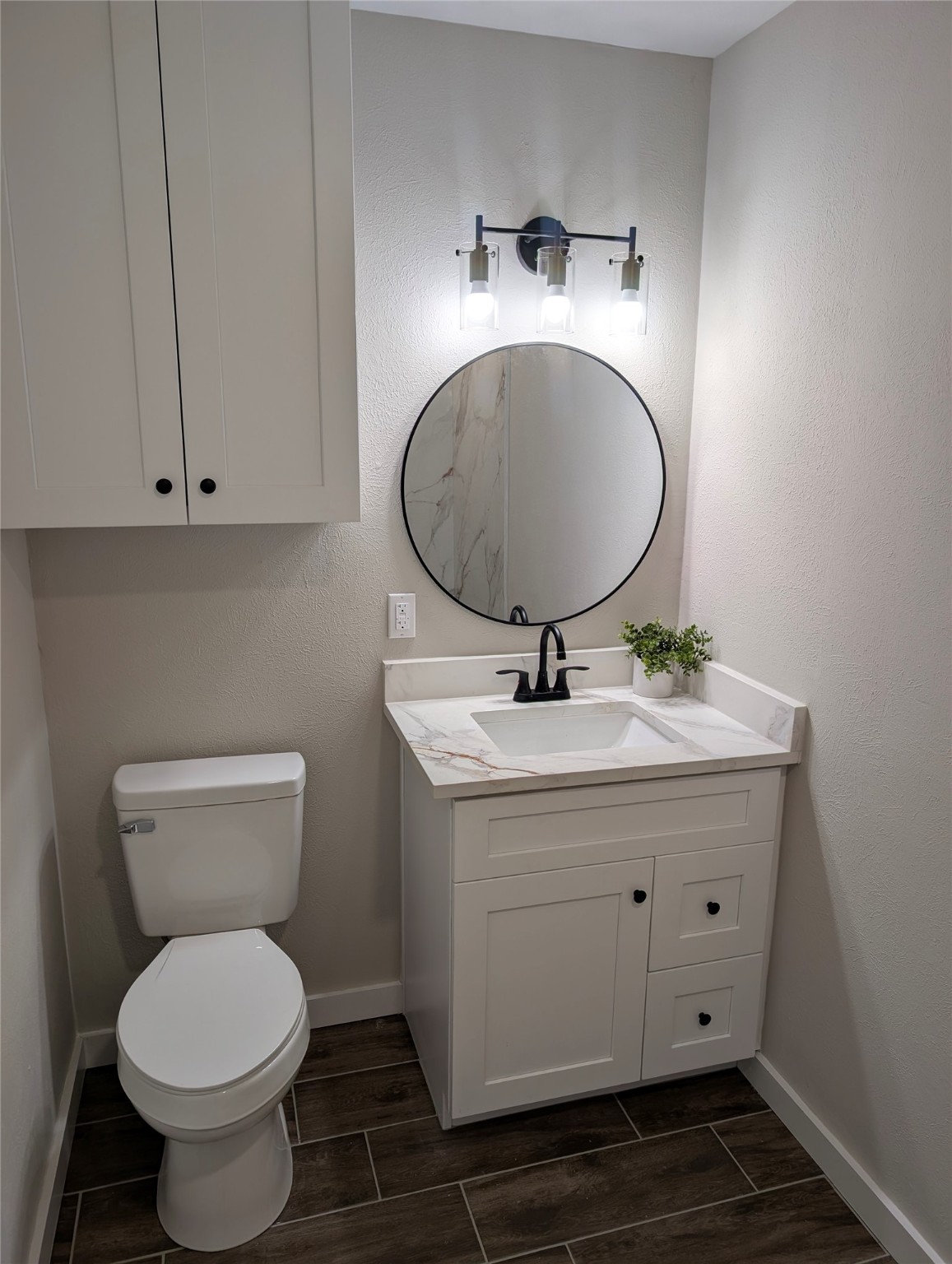 1145 Cuniff Road Sour Lake, TX 77659 - Photo 10 of 22 a bathroom with a toilet sink and mirror
