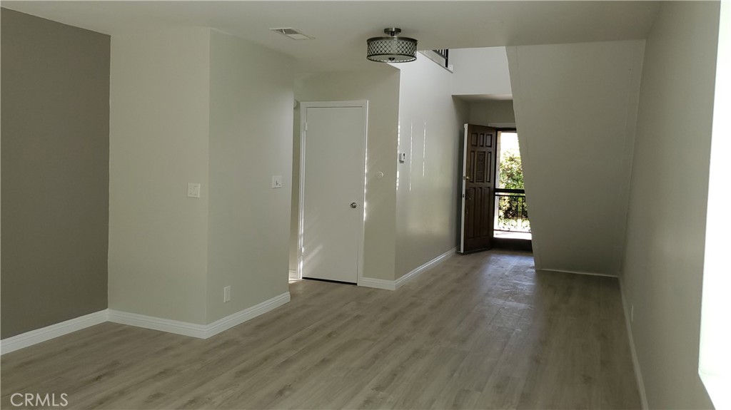 423 East Duarte Road, Unit A Arcadia, CA 91006 - Photo 5 of 11 a view of a hallway with wooden floor