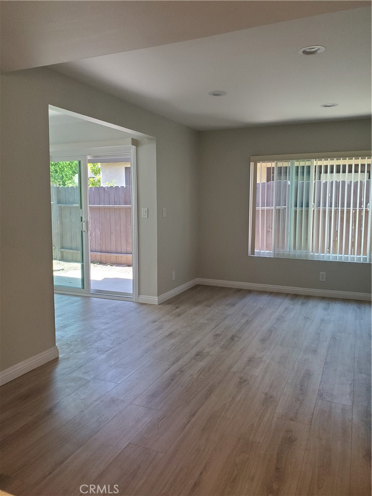 423 East Duarte Road, Unit A Arcadia, CA 91006 - Photo 6 of 11 a view of an empty room with wooden floor and a window