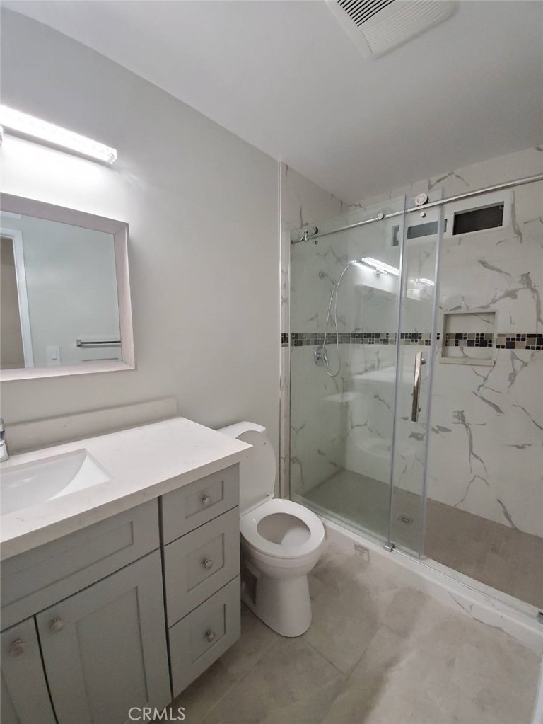 423 East Duarte Road, Unit A Arcadia, CA 91006 - Photo 8 of 11 a bathroom with a shower sink vanity mirror and toilet