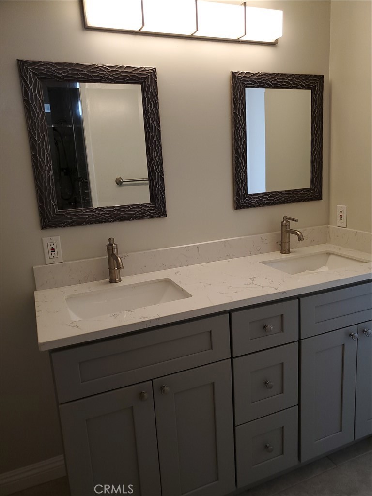 423 East Duarte Road, Unit A Arcadia, CA 91006 - Photo 9 of 11 a bathroom with a double vanity sink and a mirror