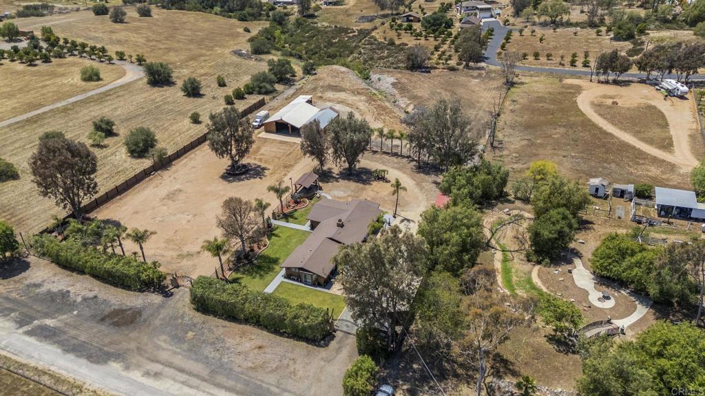 30265 Miller Road Valley Center, CA 92082 - Photo 53 of 56 an aerial view of a house with a yard and lake view