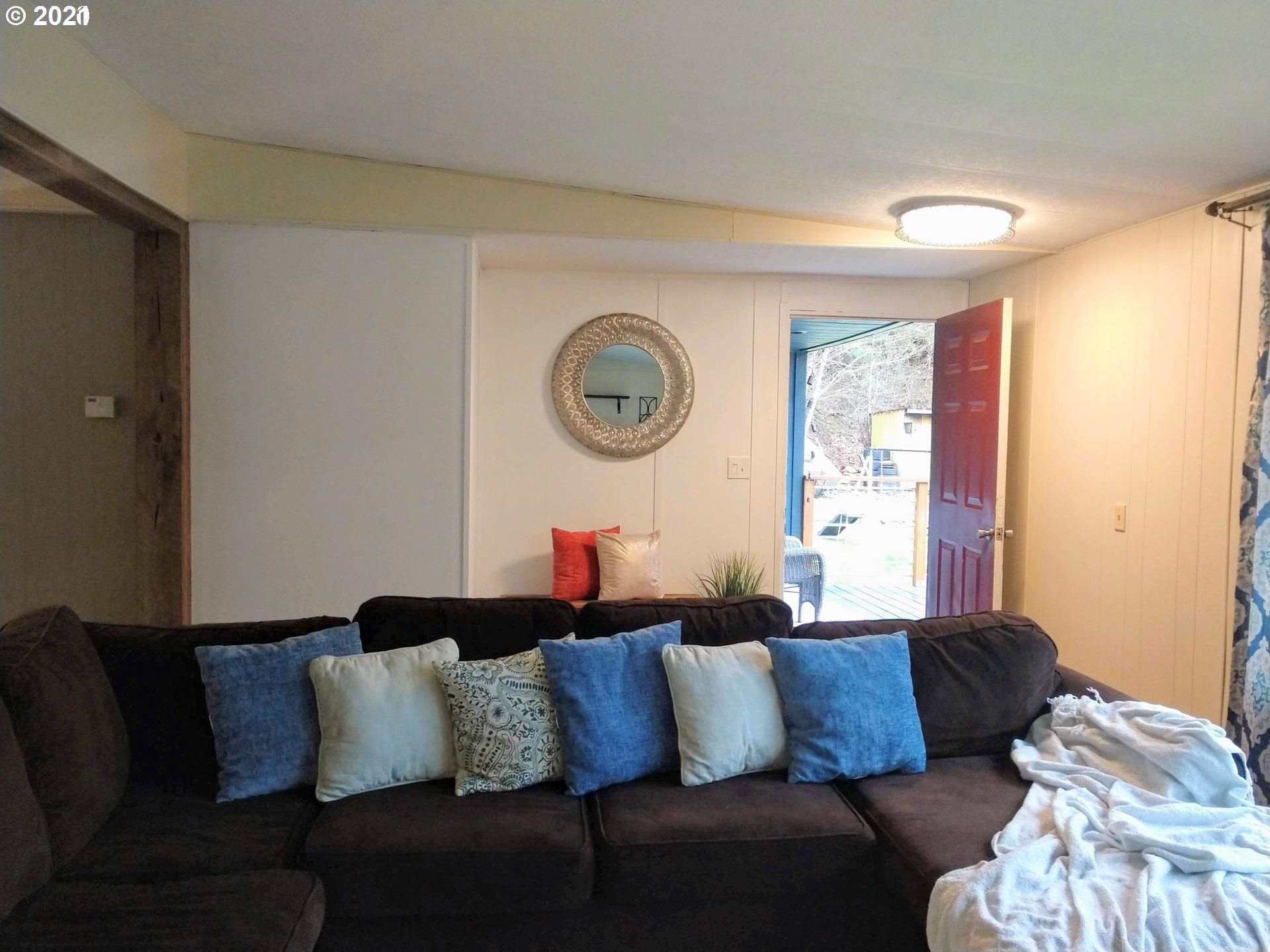 565 Eastside Road Hood River, OR 97031 - Photo 2 of 28 a living room with furniture and a large window