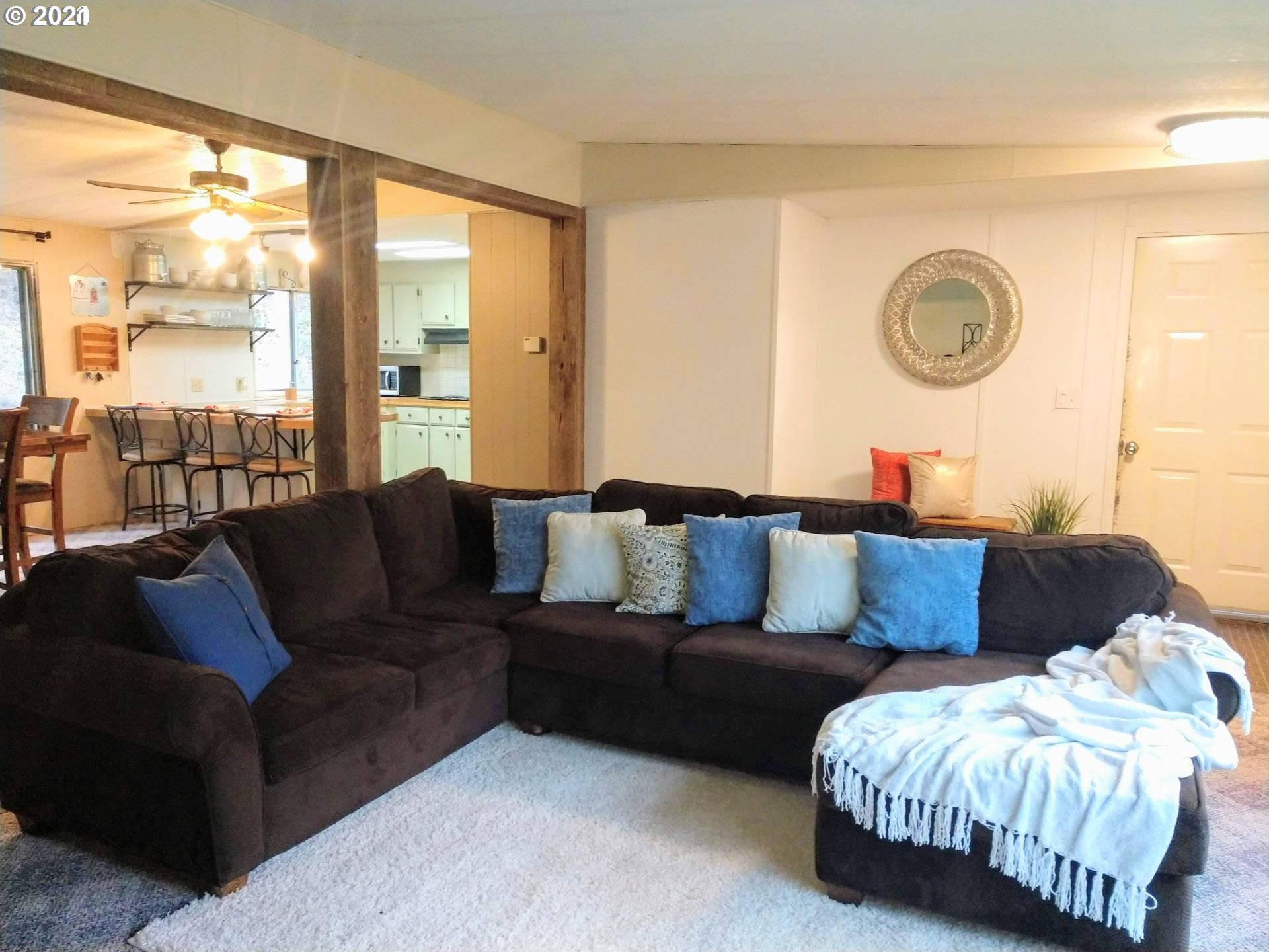 565 Eastside Road Hood River, OR 97031 - Photo 3 of 28 a living room with furniture and a window