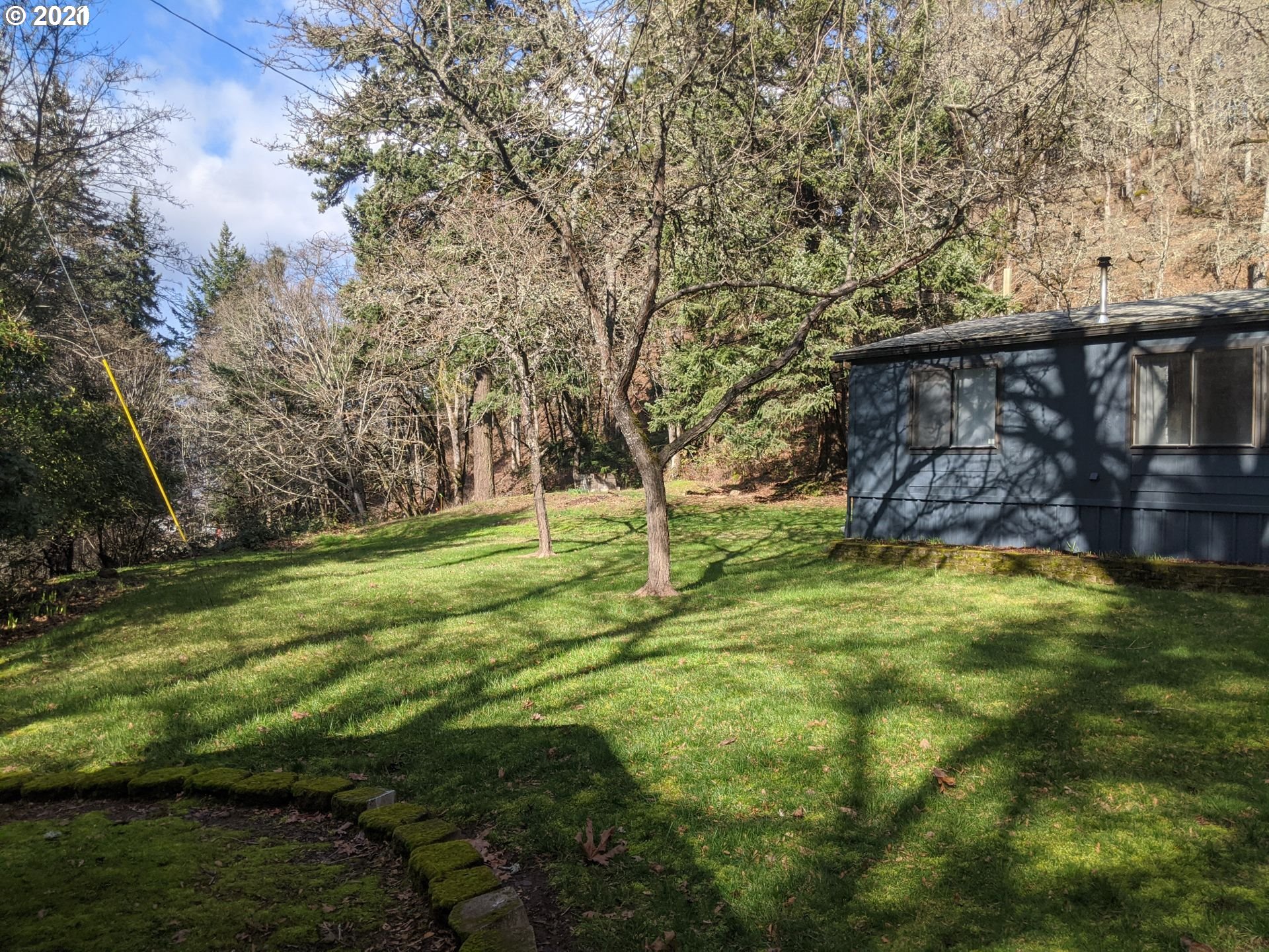 565 Eastside Road Hood River, OR 97031 - Photo 23 of 28 a backyard of a house with lots of green space