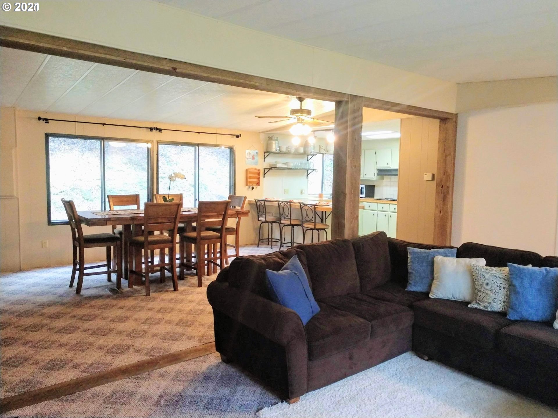 565 Eastside Road Hood River, OR 97031 - Photo 4 of 28 a living room with furniture and a large window