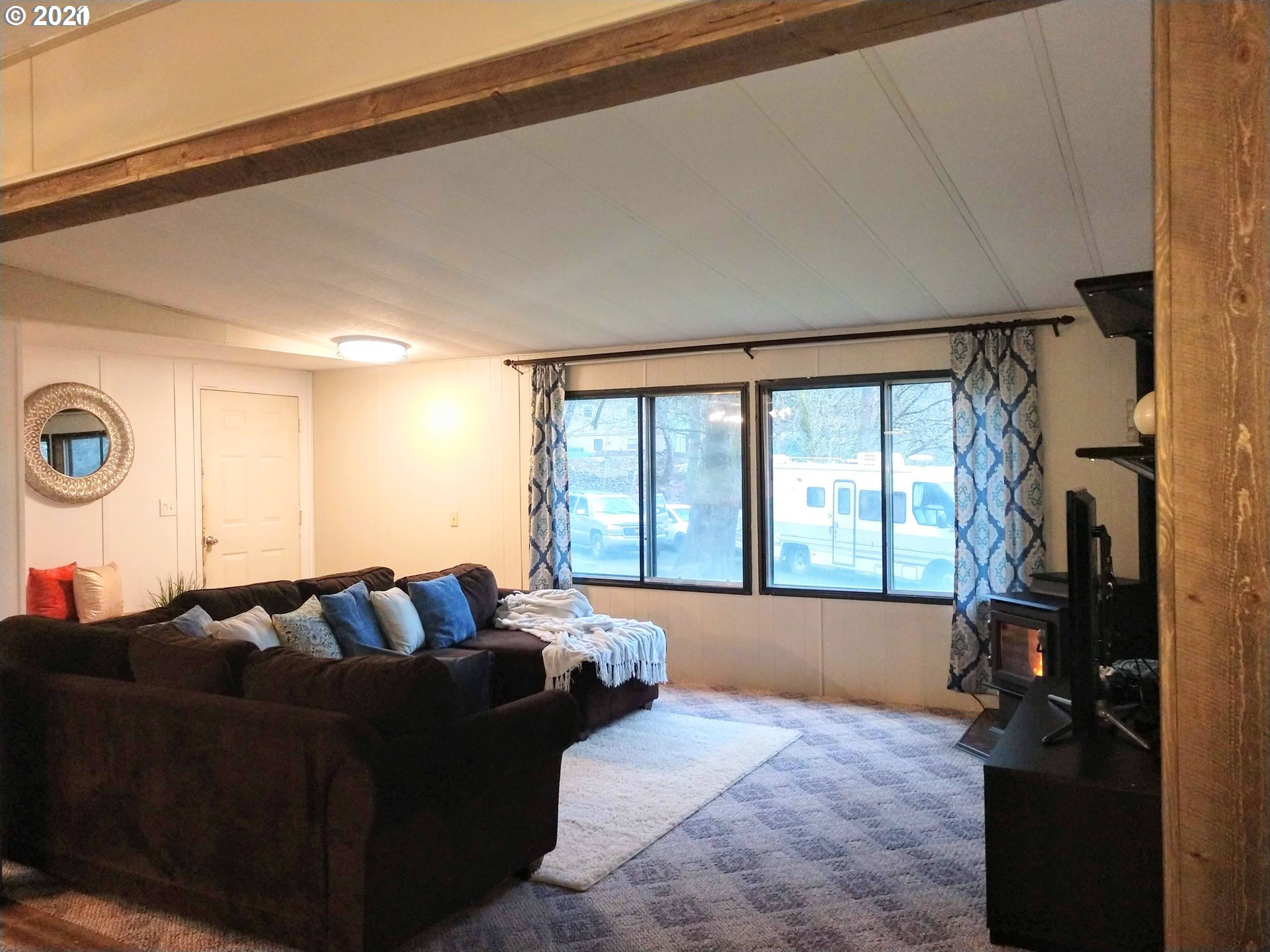 565 Eastside Road Hood River, OR 97031 - Photo 5 of 28 a living room with furniture and a large window