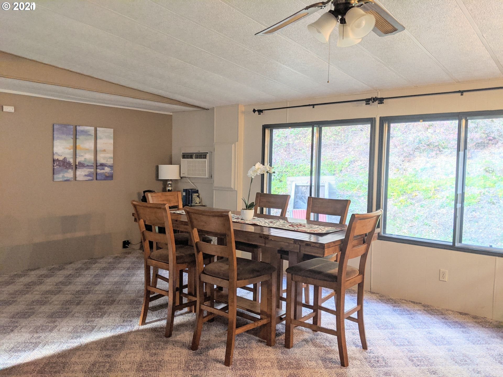 565 Eastside Road Hood River, OR 97031 - Photo 8 of 28 a view of a dining room with furniture window and outside view