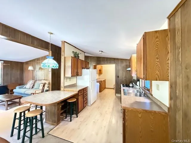 an empty room with windows and flat screen tv