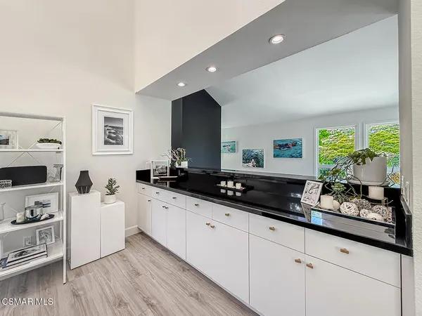 a spacious bathroom with a double vanity sink and a window