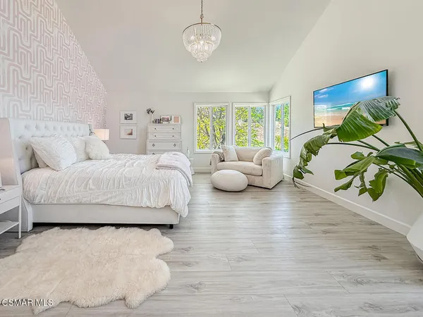 a bedroom with bed and window