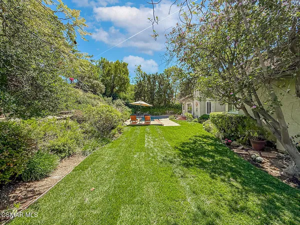 a view of a garden with houses
