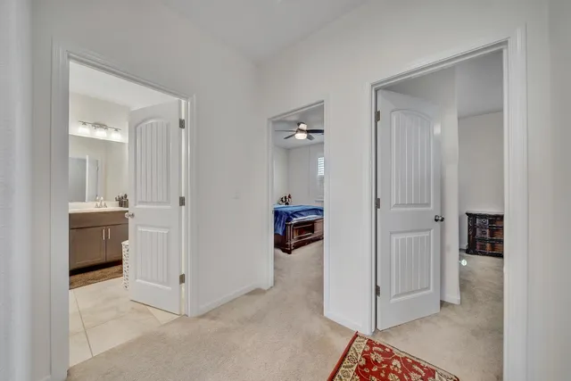 a bedroom with a bed a desk and chair